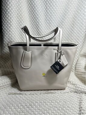 Coach X Peanuts Woodstock Taxi Tote 24
